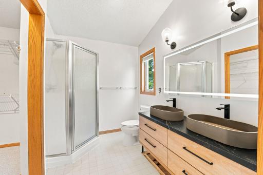 Primary bathroom with double sinks and plenty of storage