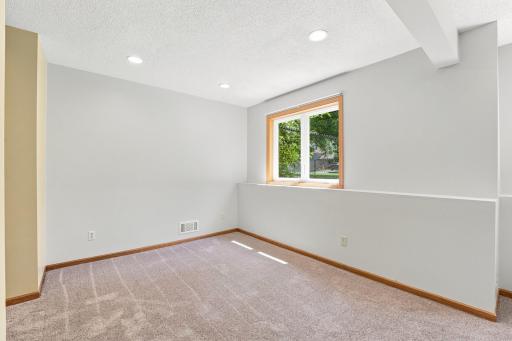 Other side of lower level with another window