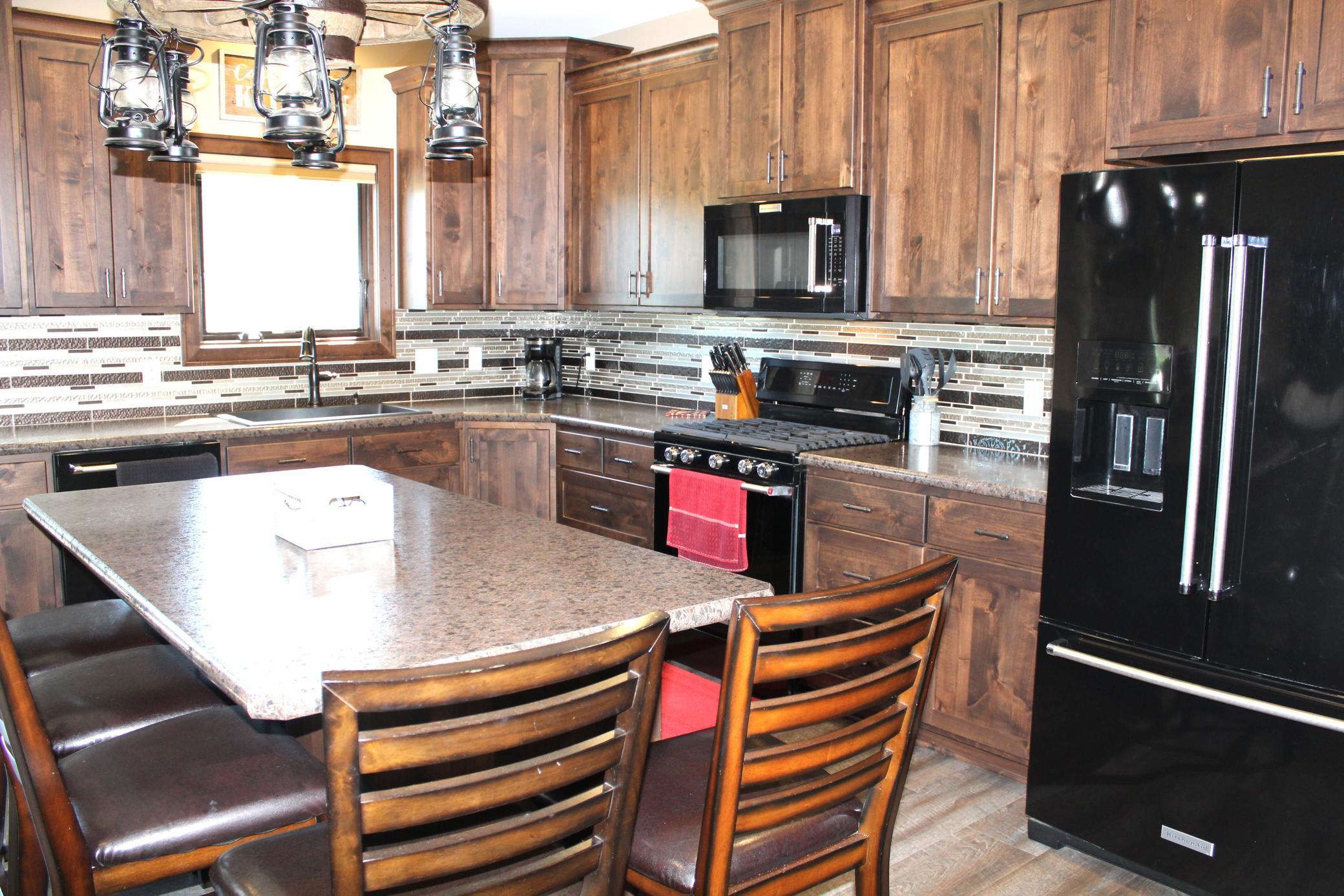 Kitchen-w/ under cabinet lighting, gas range