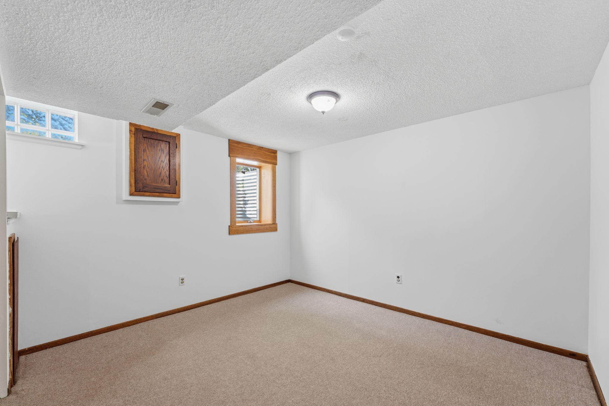 Lower level 5th bedroom with egress window