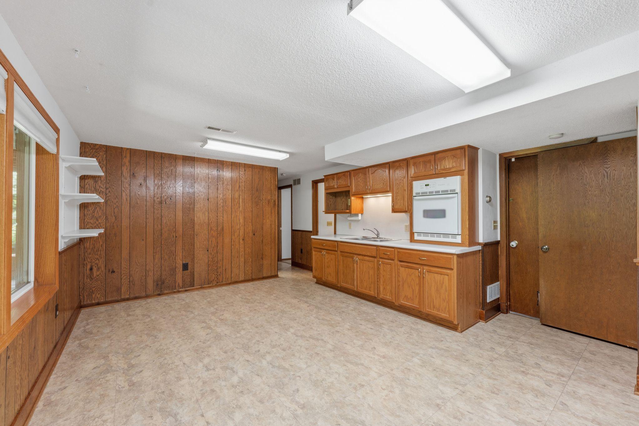 Lower level with a sink and oven