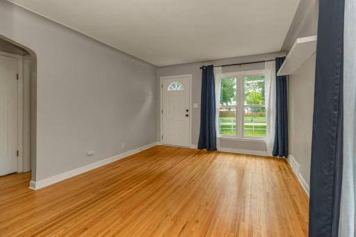 Front door enters into this spacious living room offering lots of natural lot and hardwood floors. Yes, all new windows and comfortably cooled by the new air conditioner!