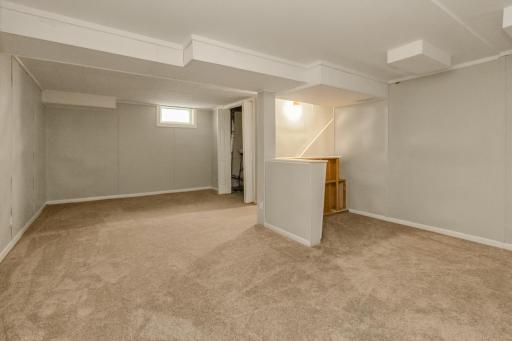 Moving downstairs you have a generous recreation space and cozy dry bar!