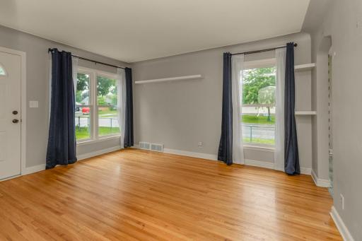 With another peek at the living room you can see the large (NEW) windows and the ample size of this room