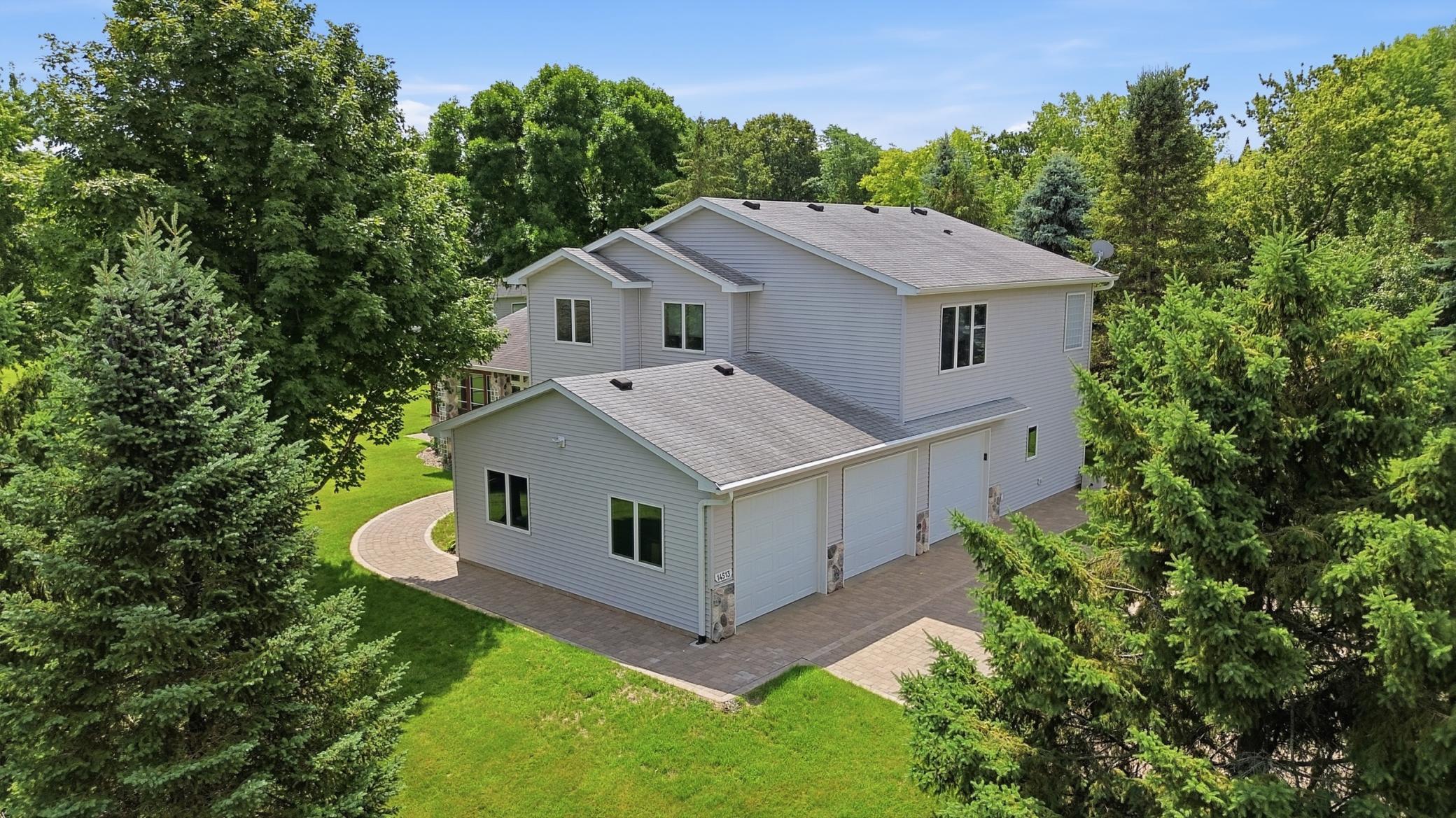 3 car garage with paver driveway