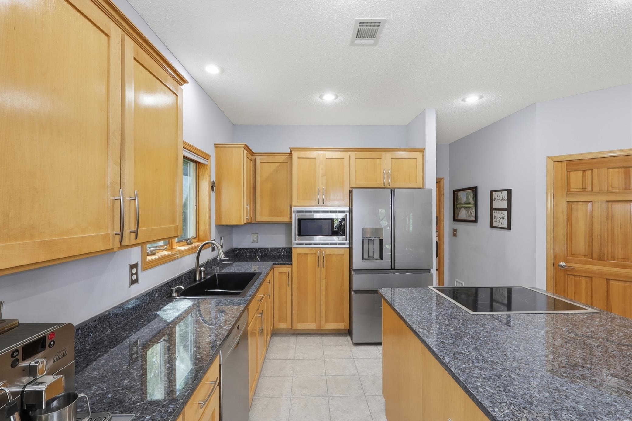 kitchen with maple cabinets and granite counters
