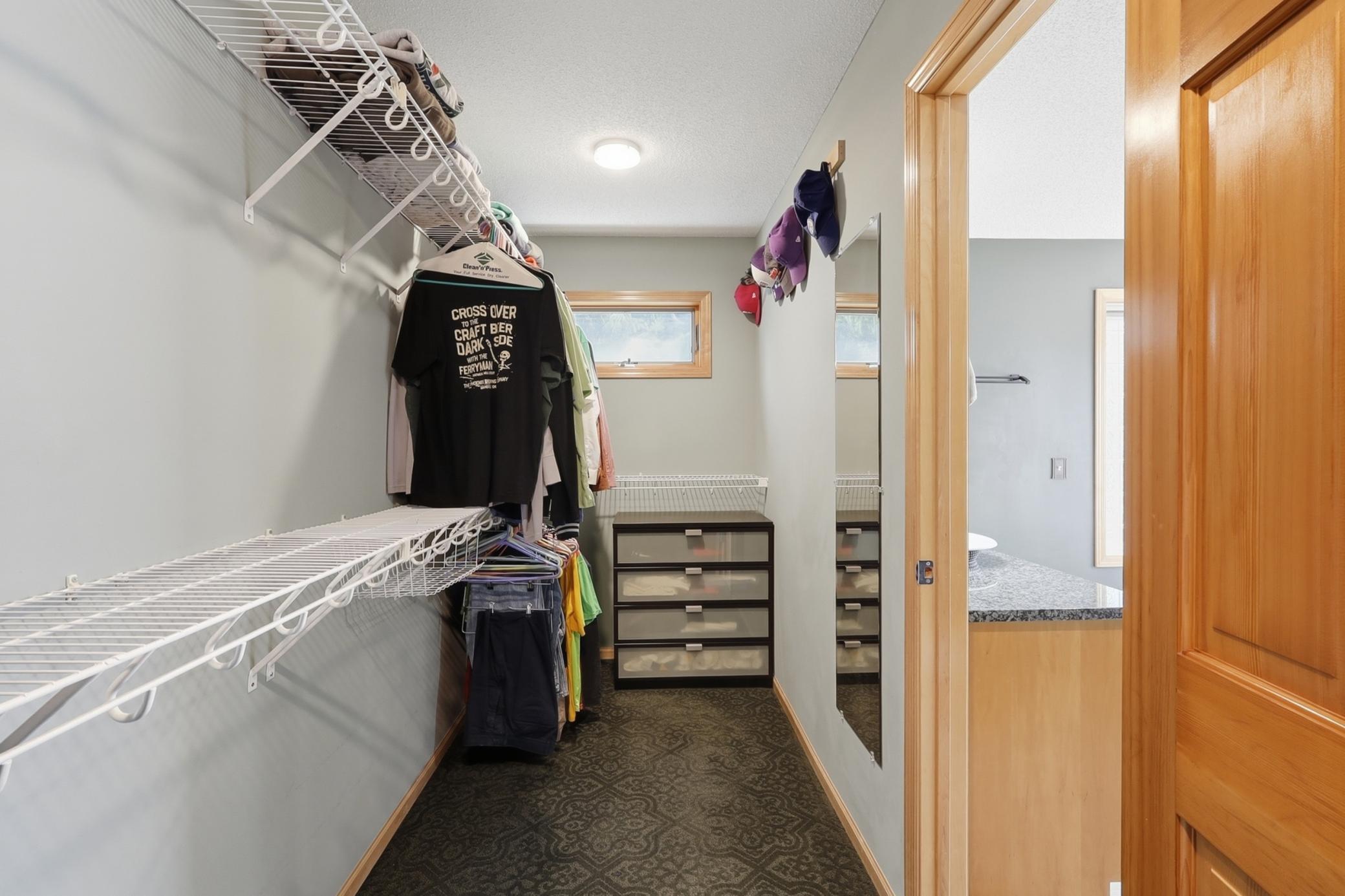 huge primary suite walk in closet