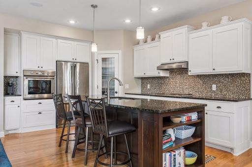 Kitchen features Thermador wall oven and cooktop, Electrolux Icon Refrigerator, Bosch - Silence Plus Dishwasher, along with walk-in pantry with adjustable shelves and roll-outs. There is even a cutting board to the right of the range!