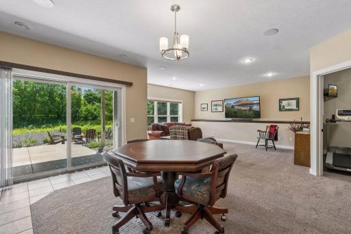 Lower level is designed to entertain and spread out. Notice the 8ft patio door - another upgrade that is evident in this home.