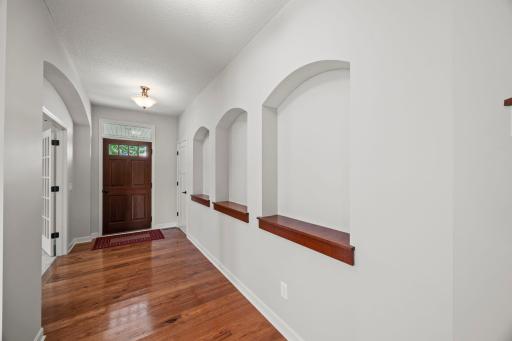 9-ft ceilings and detailed wall finishes create a welcoming first impression.