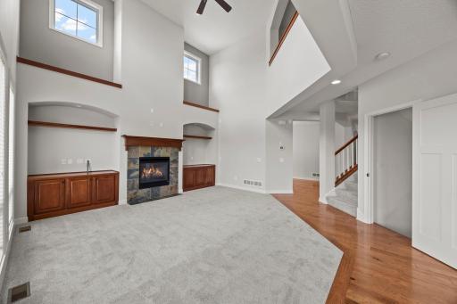 The main living area is defined by a dramatic two-story living room.
