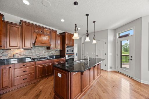The kitchen connects seamlessly to the living and dining spaces and is designed for both function and gathering.