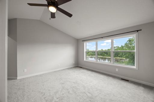 Four bedrooms are located on the upper level, including a serene primary suite.