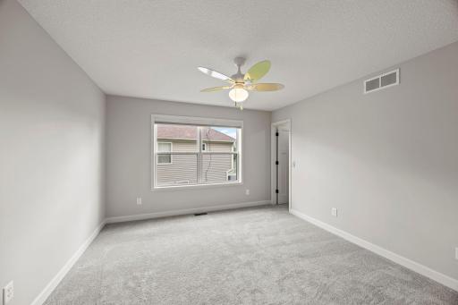 Each with plush carpet, natural light, and ceiling fans for comfort.