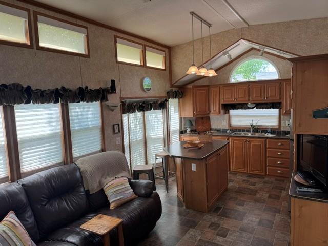 open floor plan to center island in kitchen