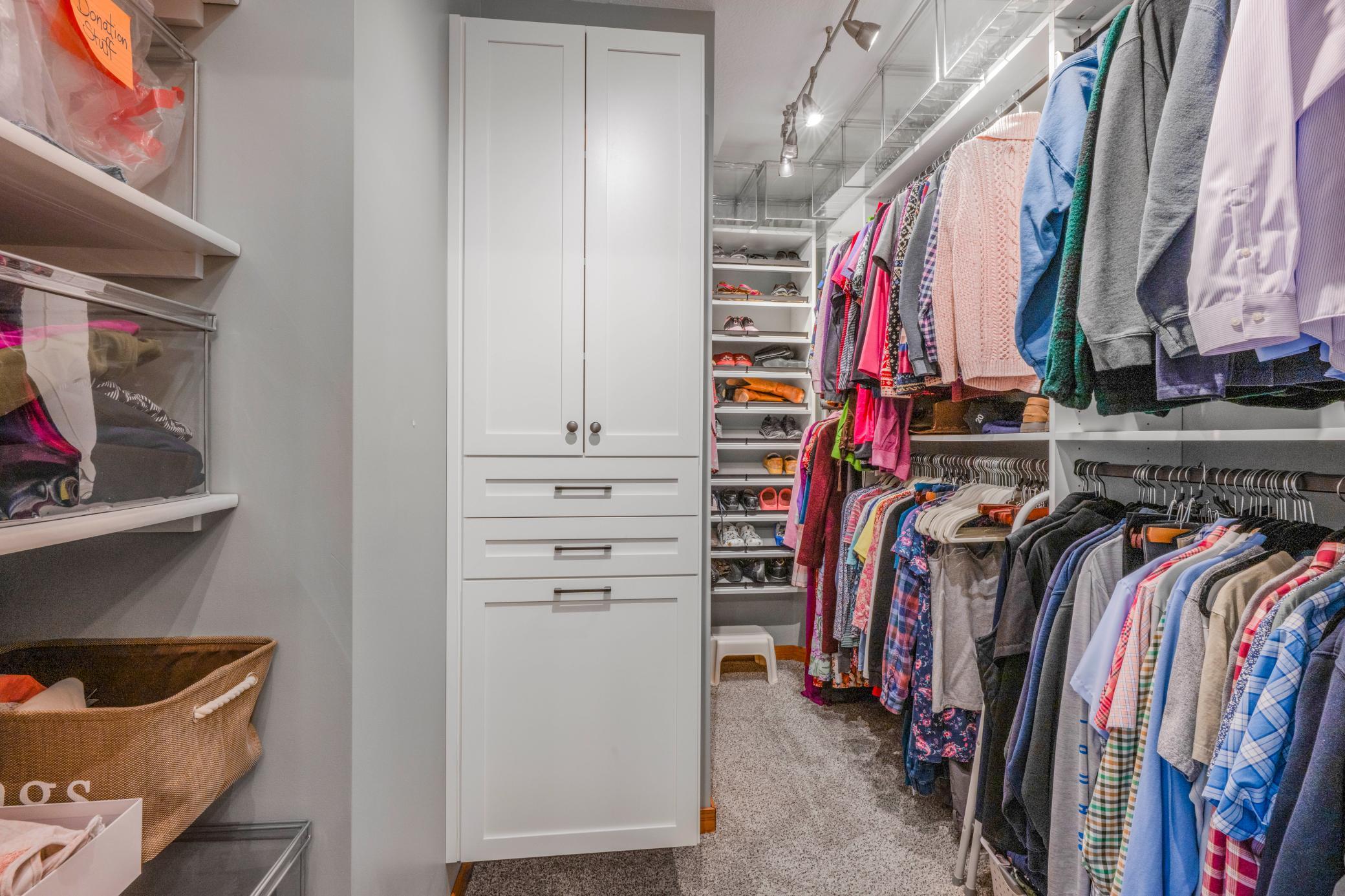 California Closets in Walk in Primary Closet!