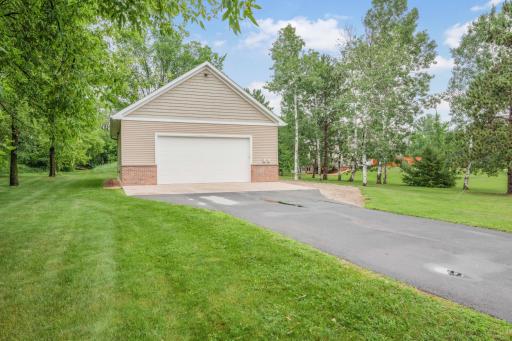 Detached Garage: Cathedral ceiling In-floor heat via boiler (natural gas) Mini-split A/C 200 Amp service 15â x 30â concrete apron in front of overhead door.