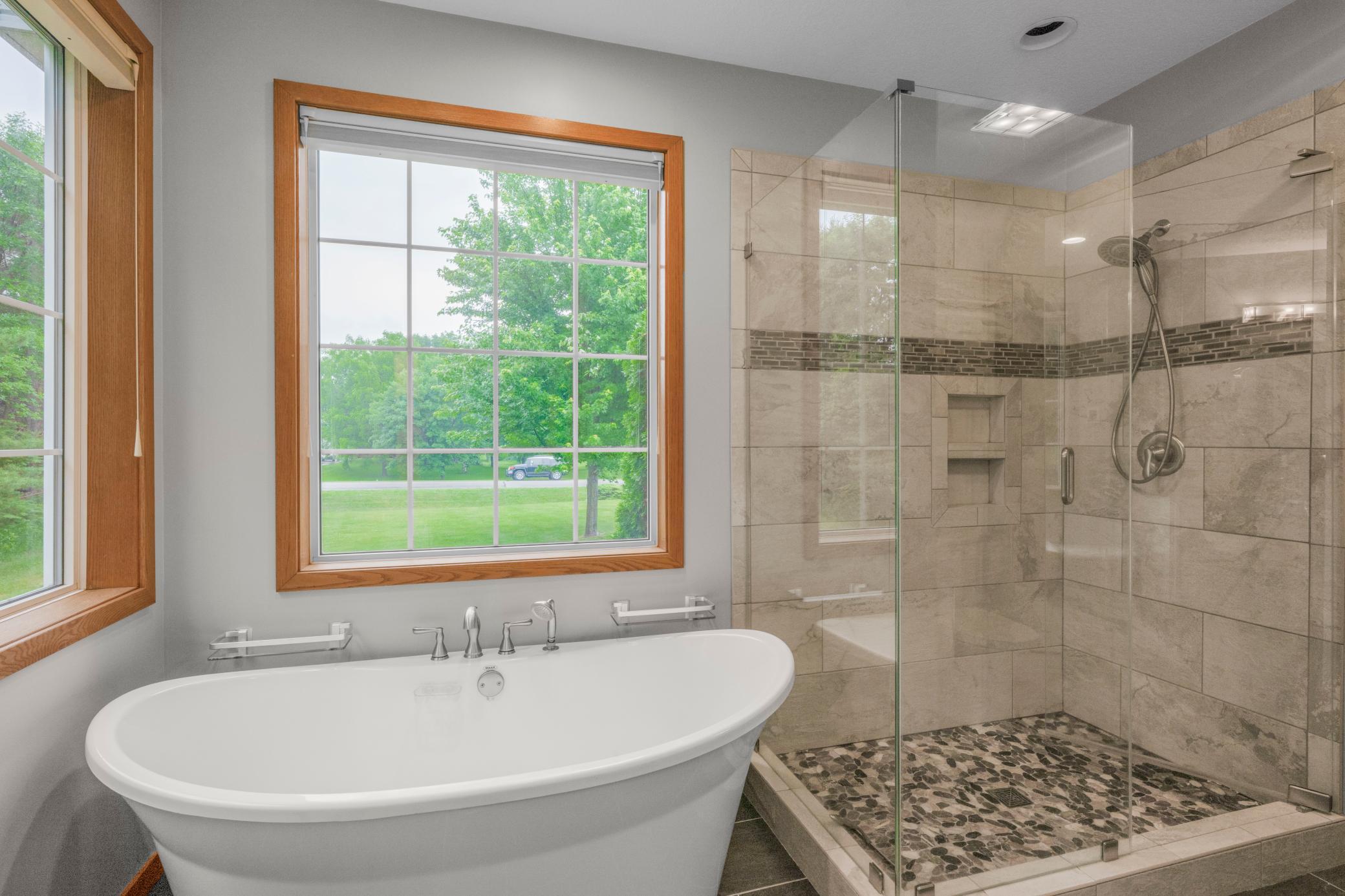 Separate Claw Foot Tub and Tiled Shower in Primary Bath!