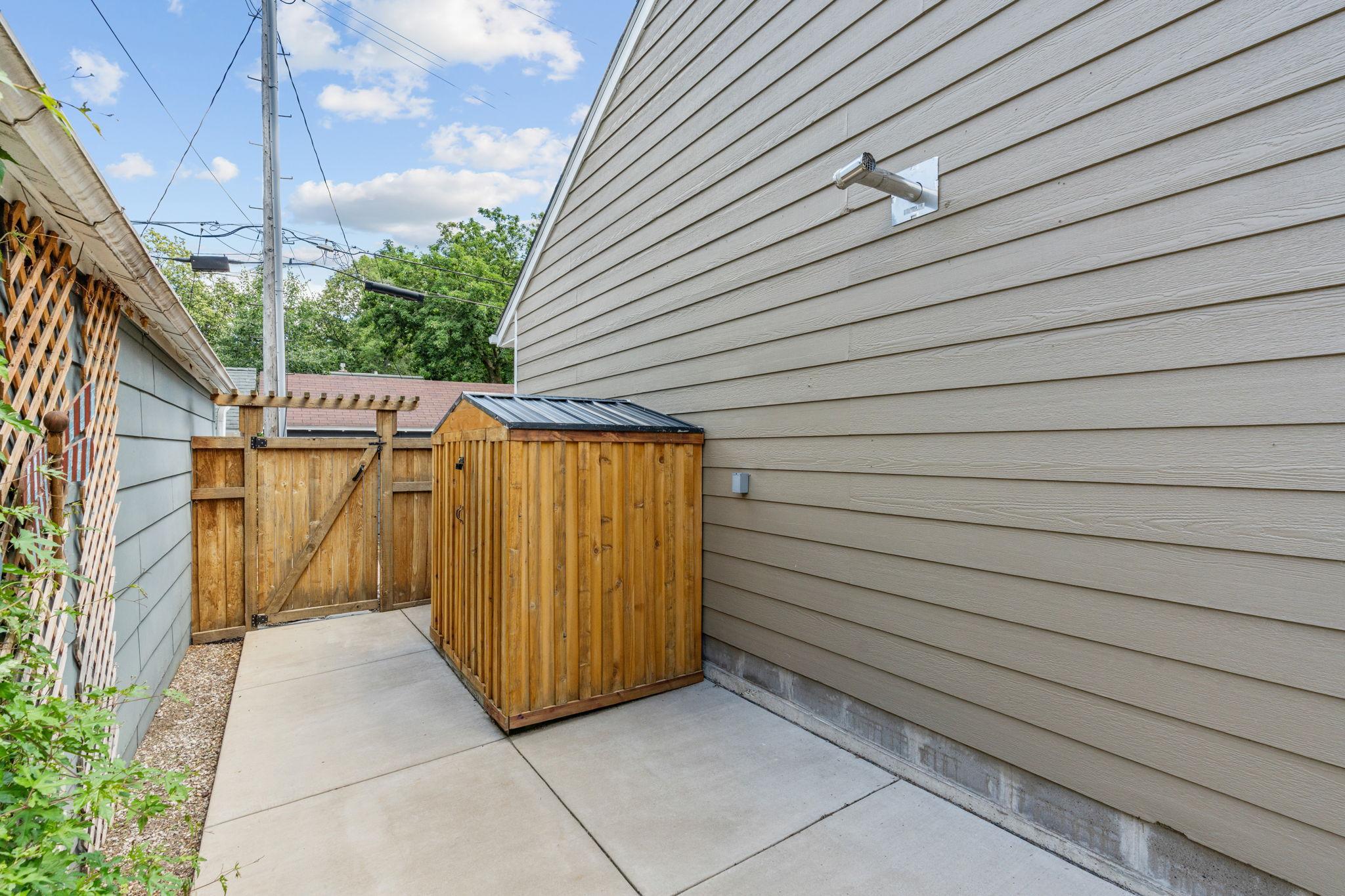 Backyard is fully paved with concrete - no grass.