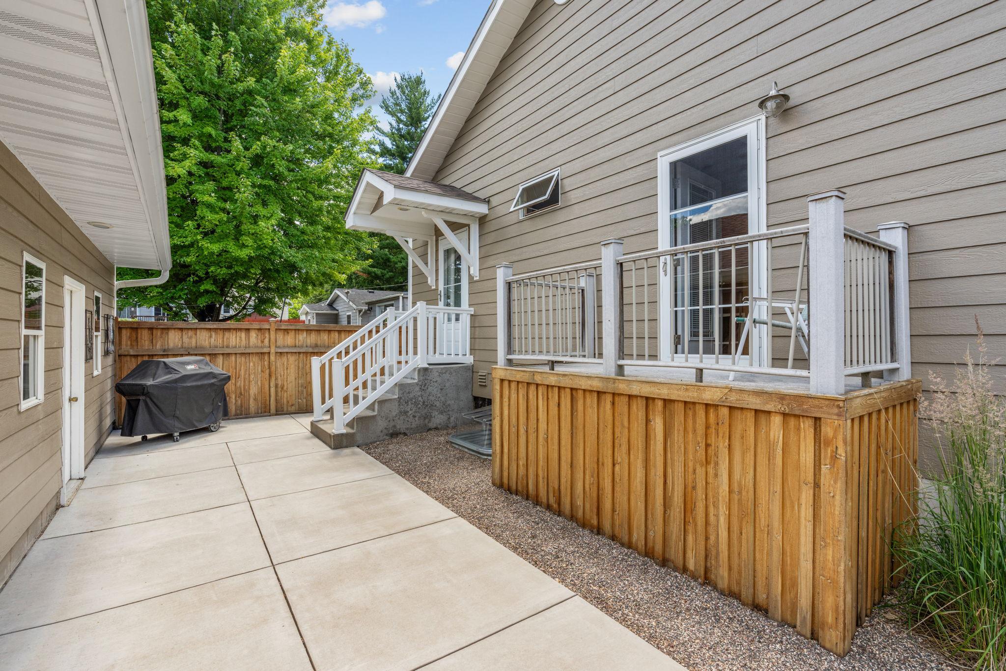 Backyard is fully paved with concrete - no grass.