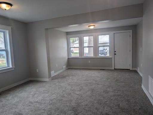 Unit 1 Dining Room looking into Living Room.jpg