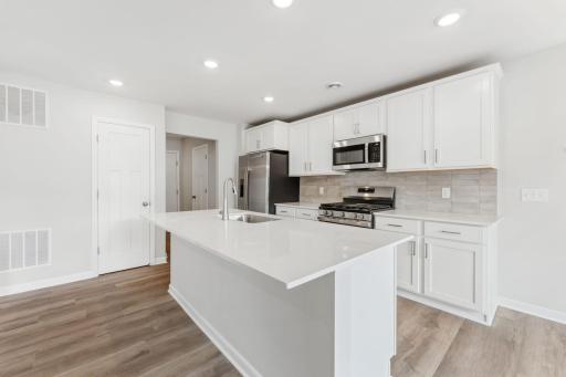Kitchen - fixtures/hardware are black. See spec finish selections.