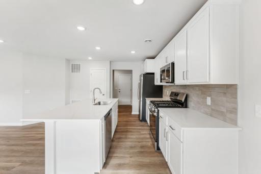 Kitchen - fixtures and hardware will be matte black. Photo is representational for layout purposes.