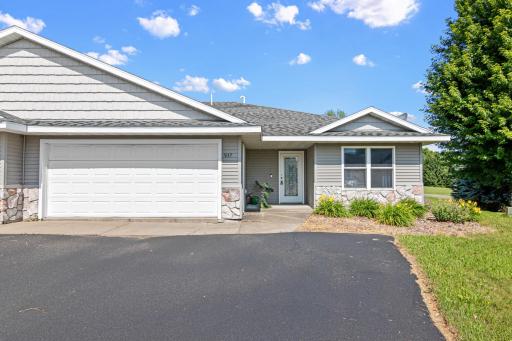 Experience the ease of main-level living in this inviting twin home on a quiet cul-de-sac