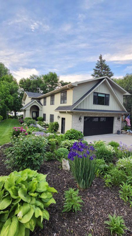 Arrive home to vibrant perennial gardens and a setting designed for making the most of every season outdoors.