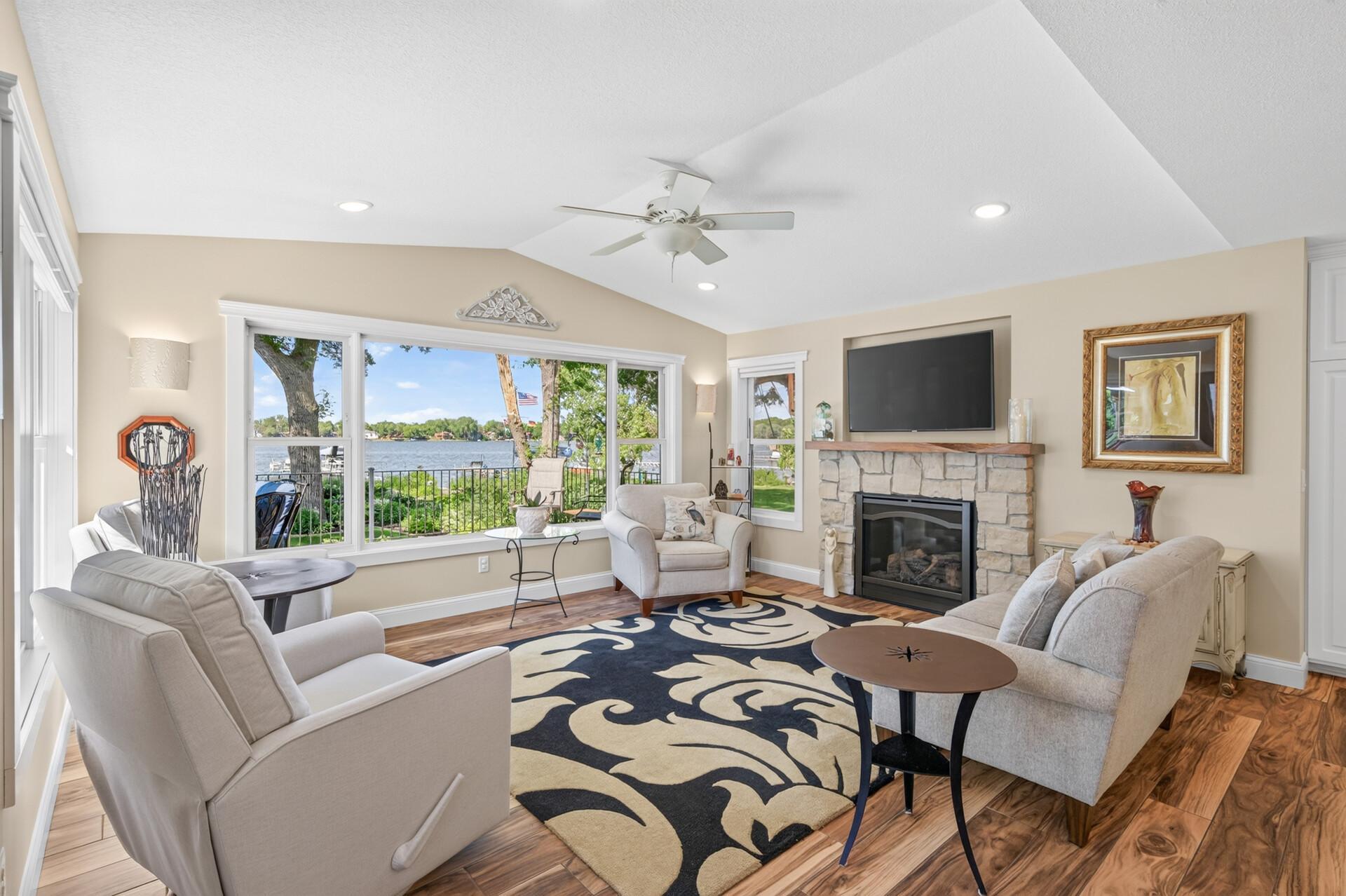 The lakeside family room offers a cozy gathering space with stunning views of the water.