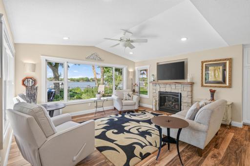 The lakeside family room offers a cozy gathering space with stunning views of the water.