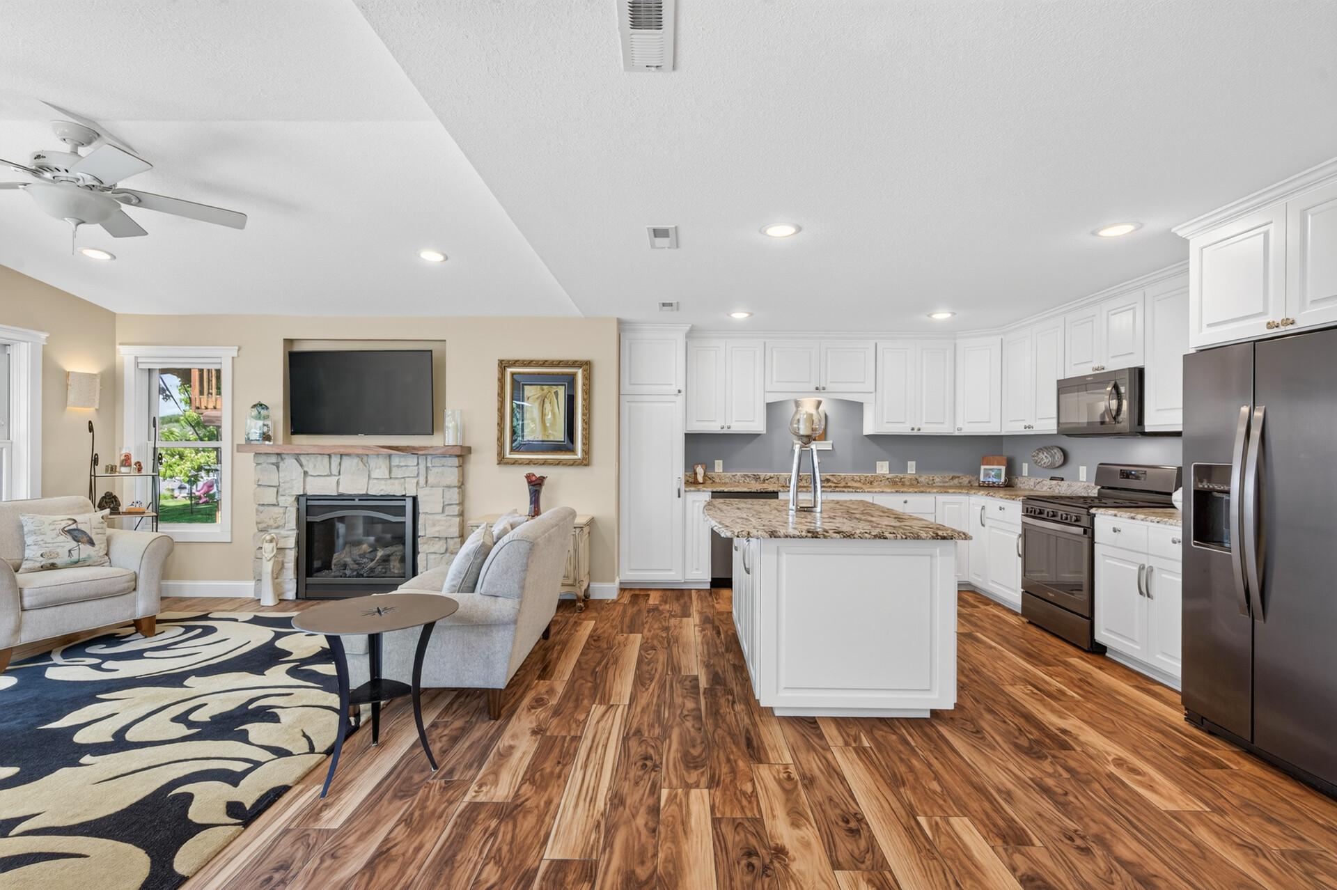 The heart of the home on the main level features an open-concept kitchen and a cozy gas fireplace in the flex room.