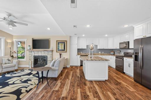 The heart of the home on the main level features an open-concept kitchen and a cozy gas fireplace in the flex room.