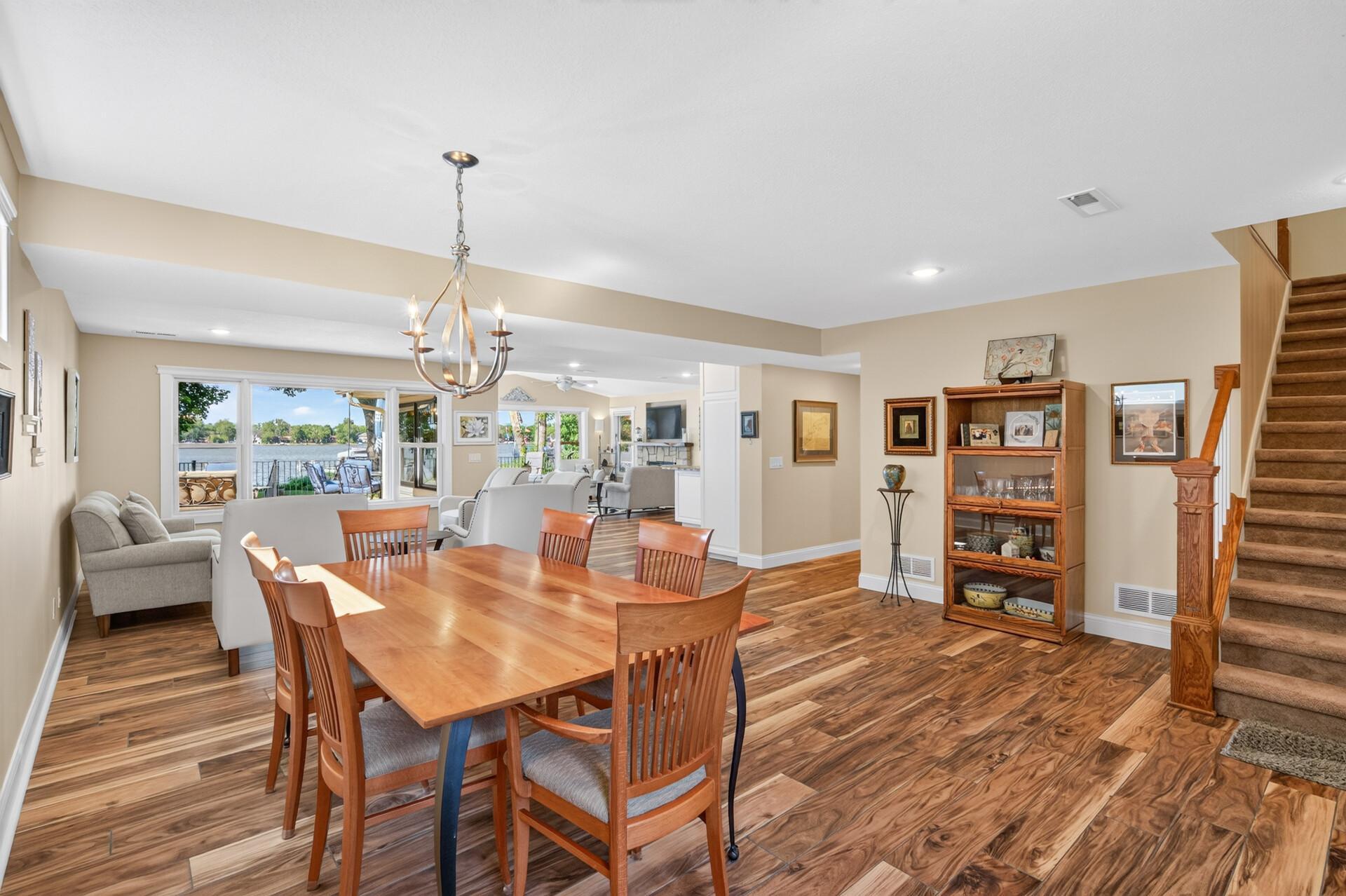 Enjoy open-concept living with hydronic radiant in-floor heated tile, an abundance of natural sunlight, and picturesque lake views.