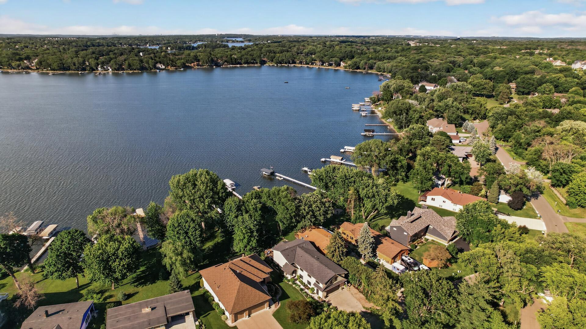 Welcome home to this custom-built waterfront estate offering 48' of prime lakeshore on Spring Lake.