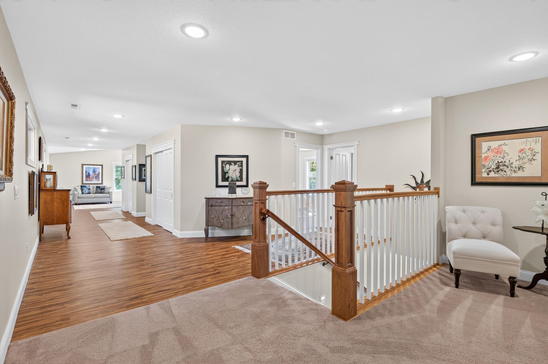 The upper level features generous living space, wide hallways, and easy access to the home's four bedrooms.