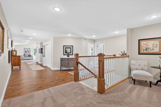 The upper level features generous living space, wide hallways, and easy access to the home's four bedrooms.