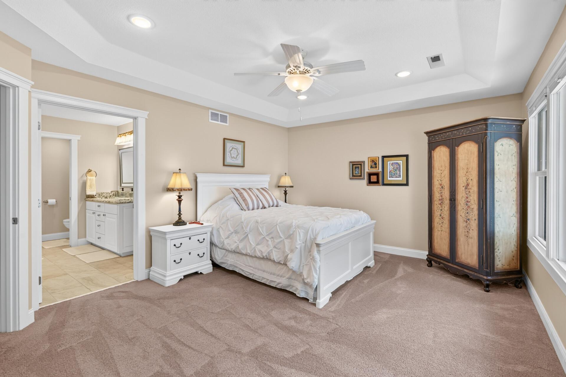 Here is an alternate view of the primary suite with a view of the en-suite bathroom.