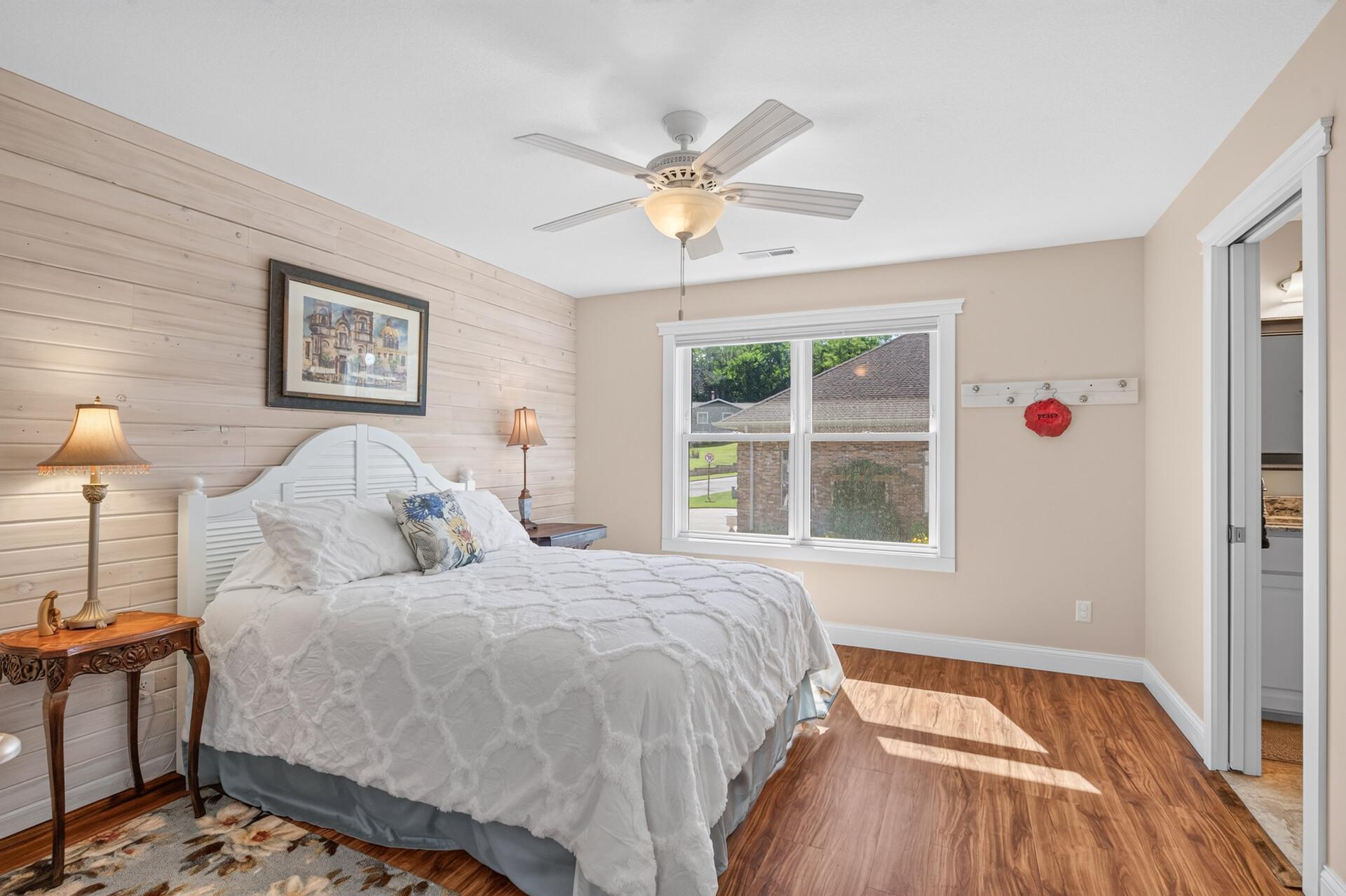 The third bedroom on the upper level offers a convenient Jack-and-Jill bathroom.