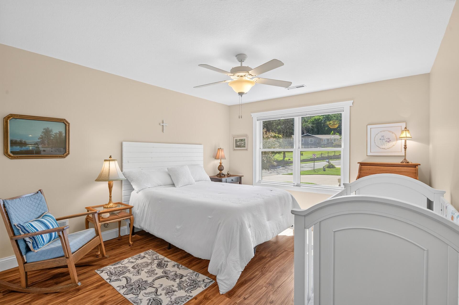 The fourth bedroom on the upper level offers a bright, comfortable retreat which is perfect for family or guests.