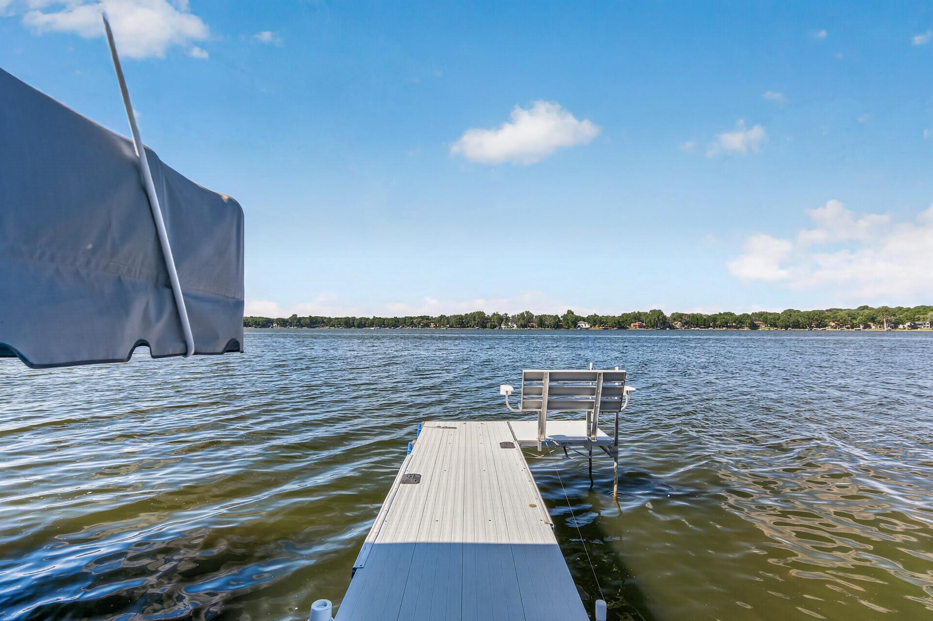 Wake up to sparkling water, gentle breezes, and endless shoreline views from your private dock. The dock, boat lift, and pontoon are available for purchase separately. See supplements for additional information.
