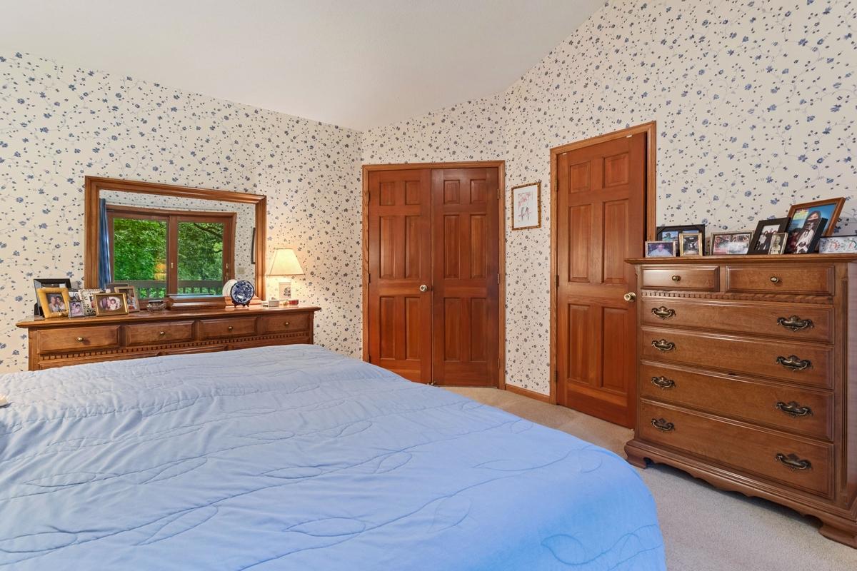 Master Bedroom with vaulted ceilings and walk in closet
