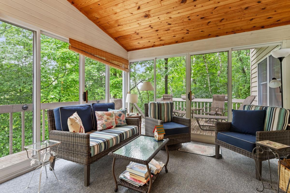 Porch overlooks wooded ravine