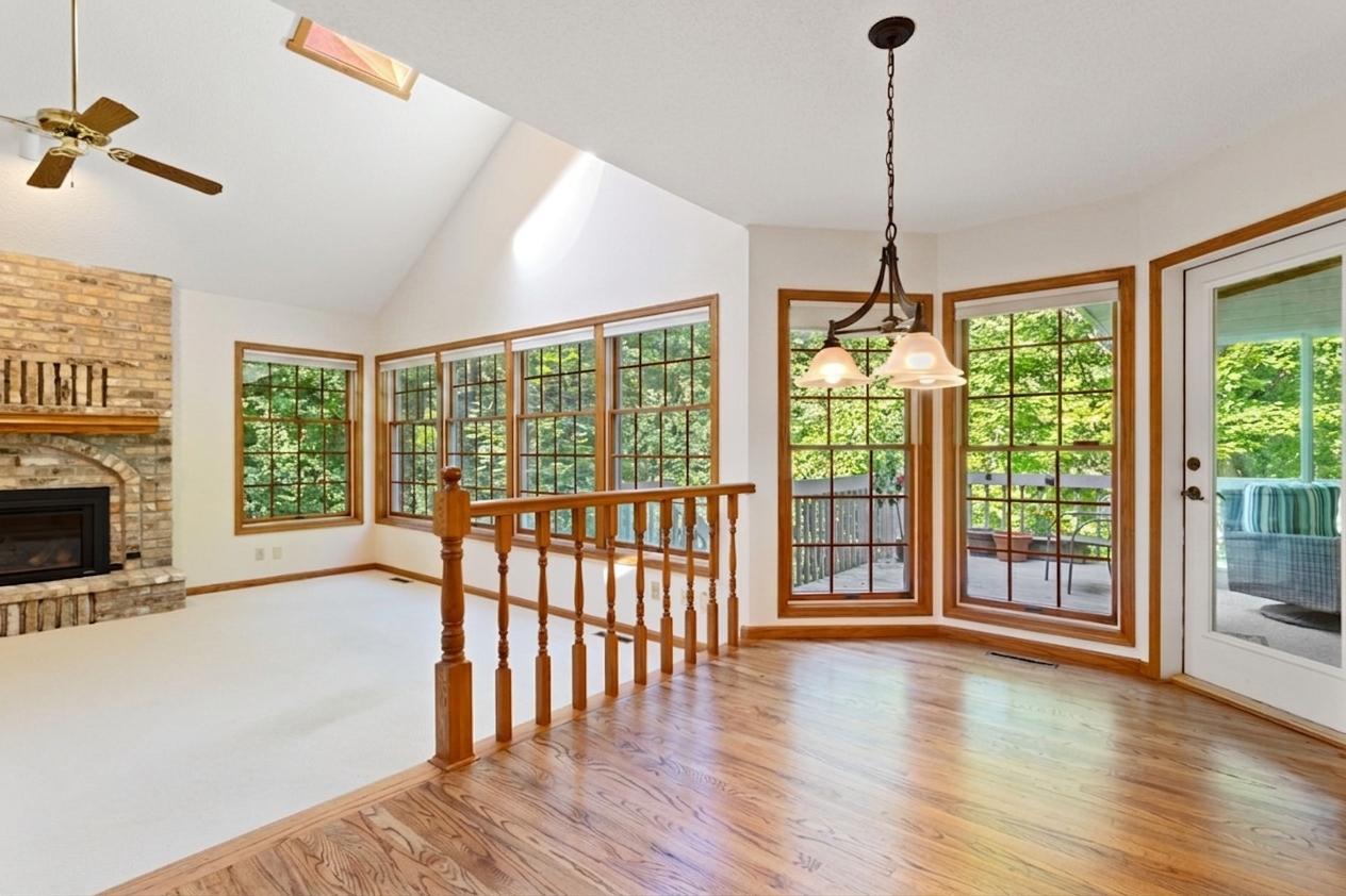 Dinette with large windows overlooks main level family room