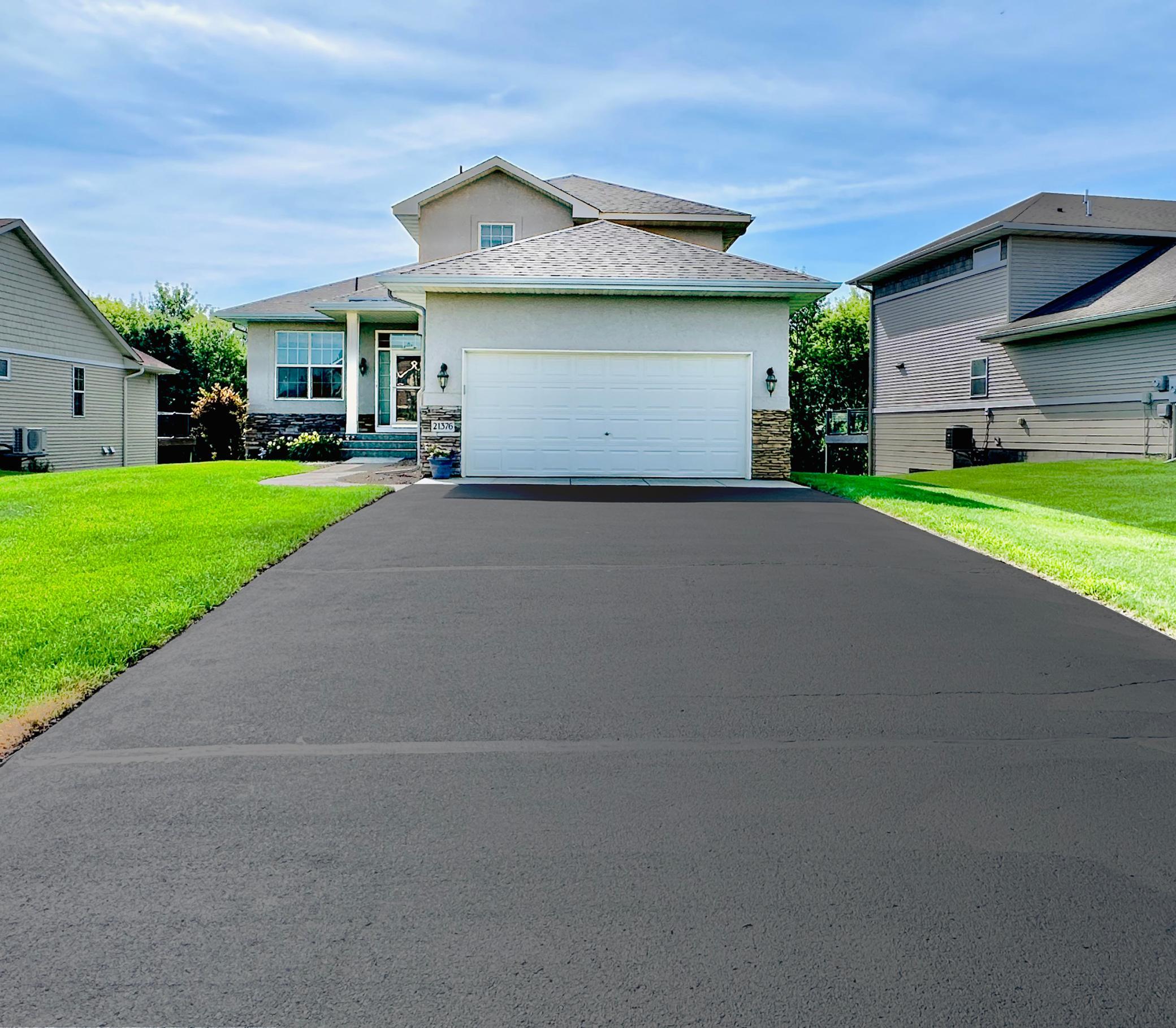 New concrete apron and driveway resurfacing this summer.