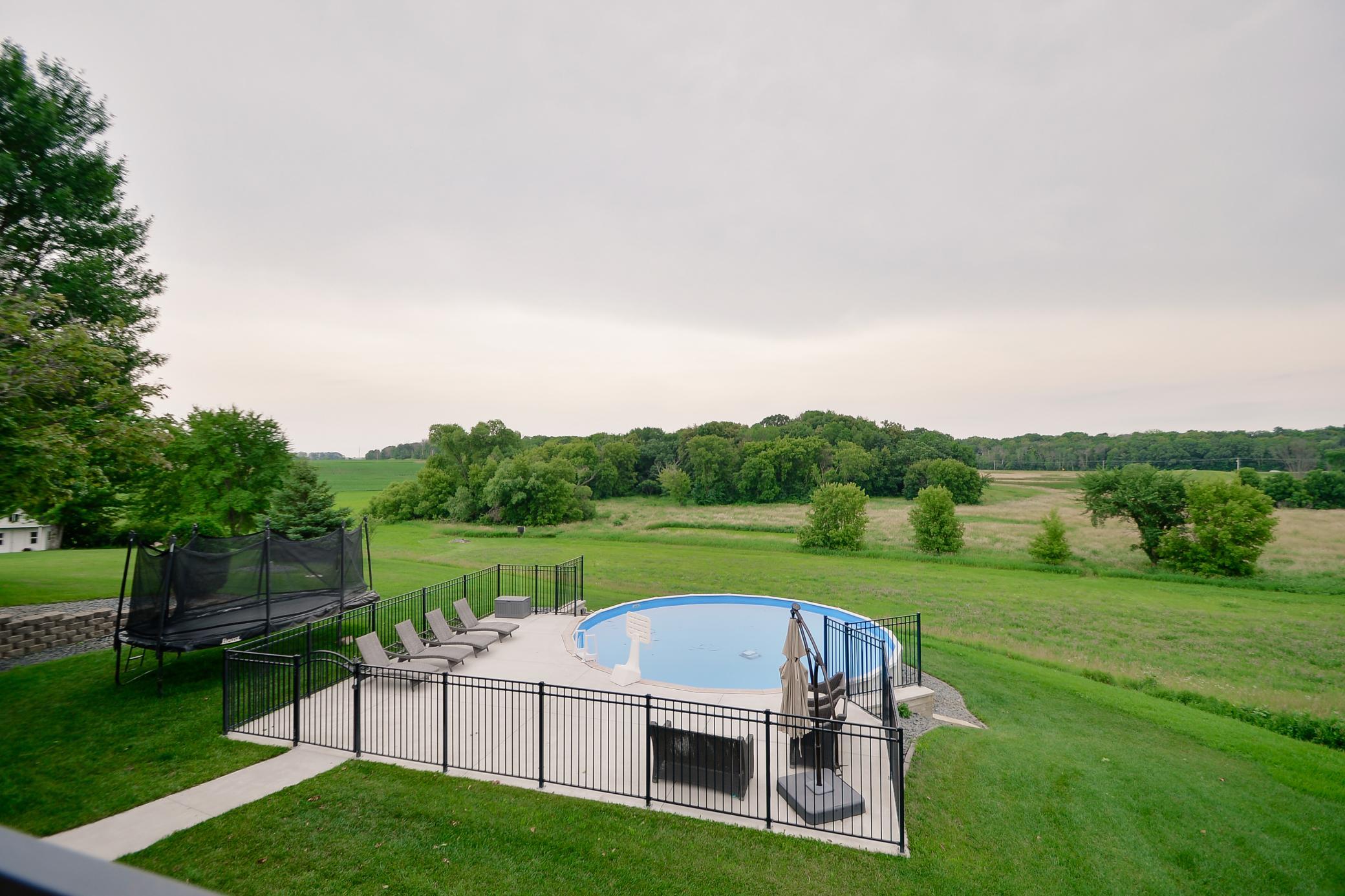 Overlooking outdoor pool and yard
