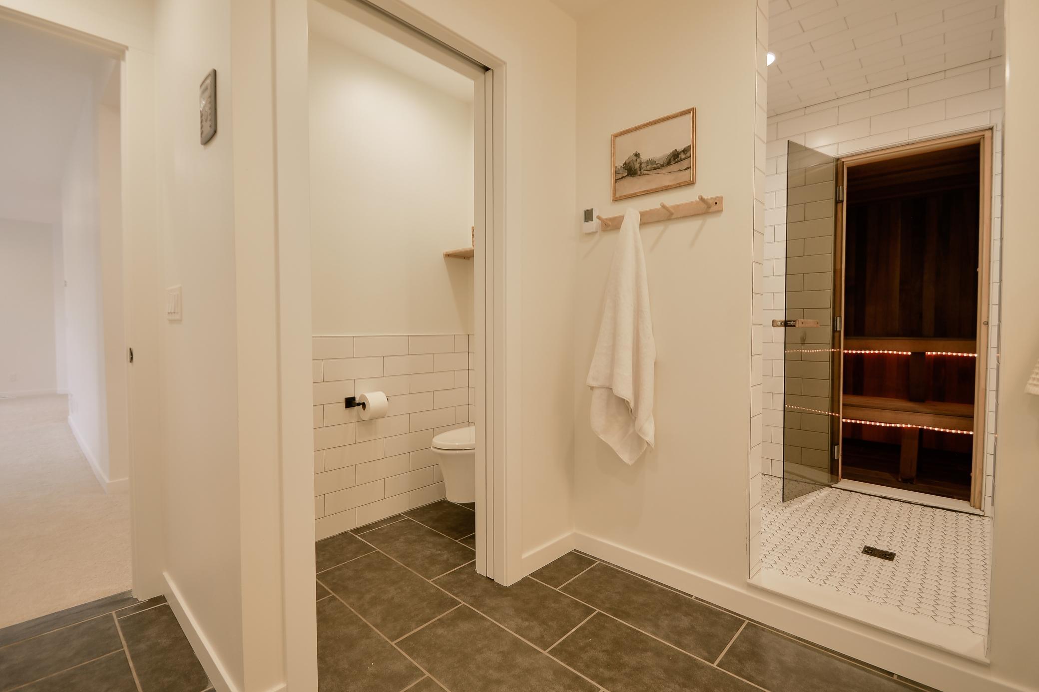 Modern bathroom, shower, and view of indoor sauna