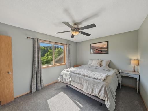 Ceiling fans and large windows in bedrooms!