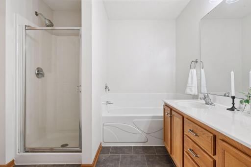 Seperate tub in shower on the upper level.