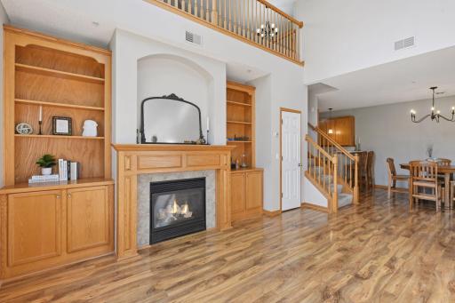 Custom built oak fireplace surround designed to blend with the built-in book-cases.